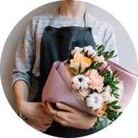 Florist holding bunch of flowers