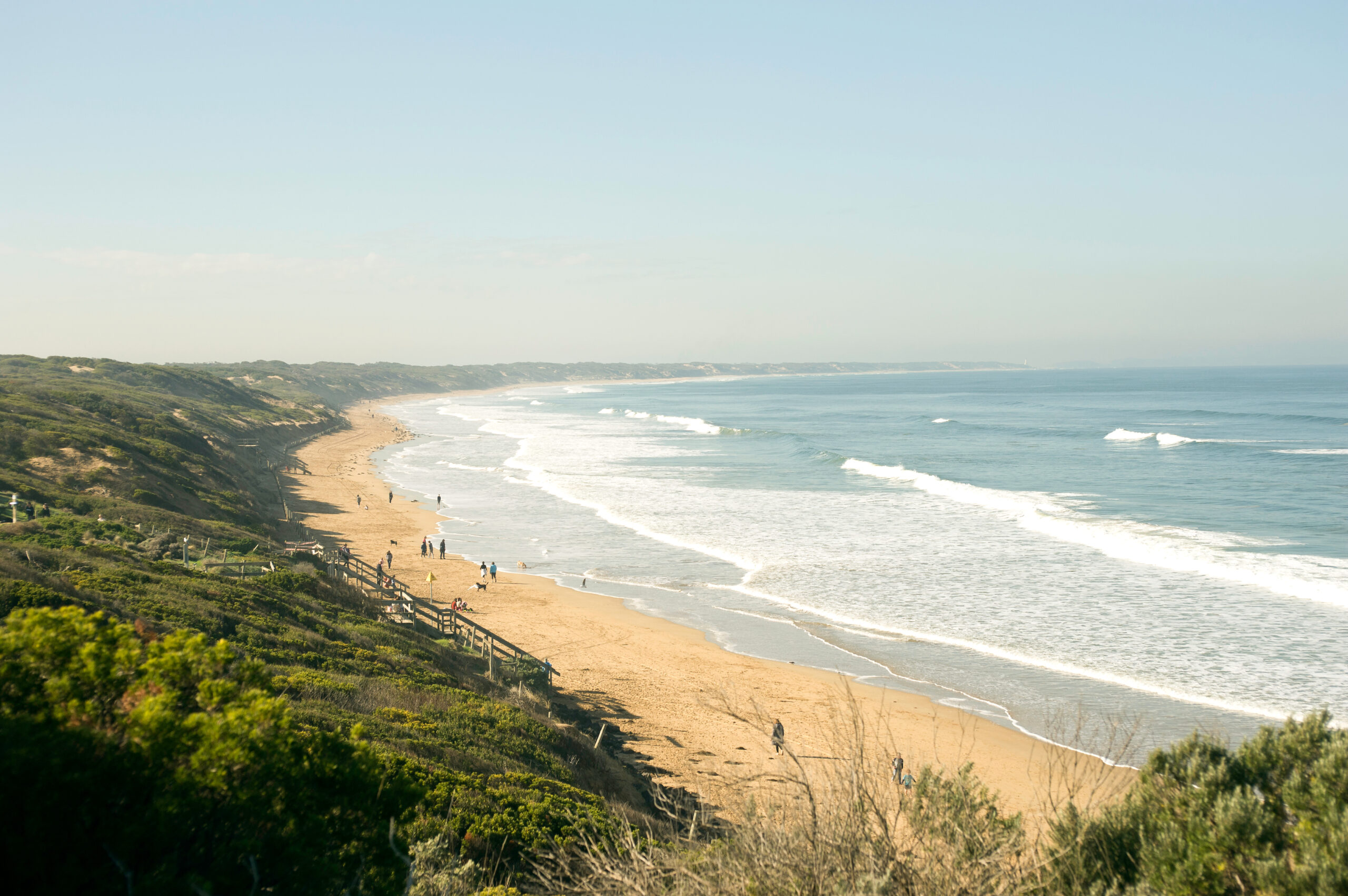 Waves lapping onto Ocean Grove beach in Victoria, Australia.